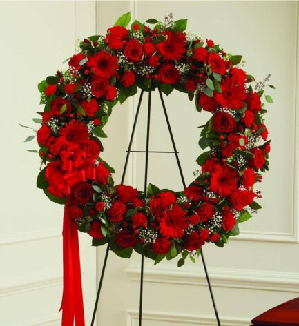 Corona flores rojas variadas y verdes variados CORONA FUNERARIA 4